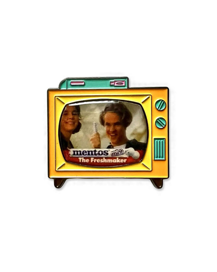 TV-shaped Mentos enamel pin with 'The Freshmaker' text and two smiling faces