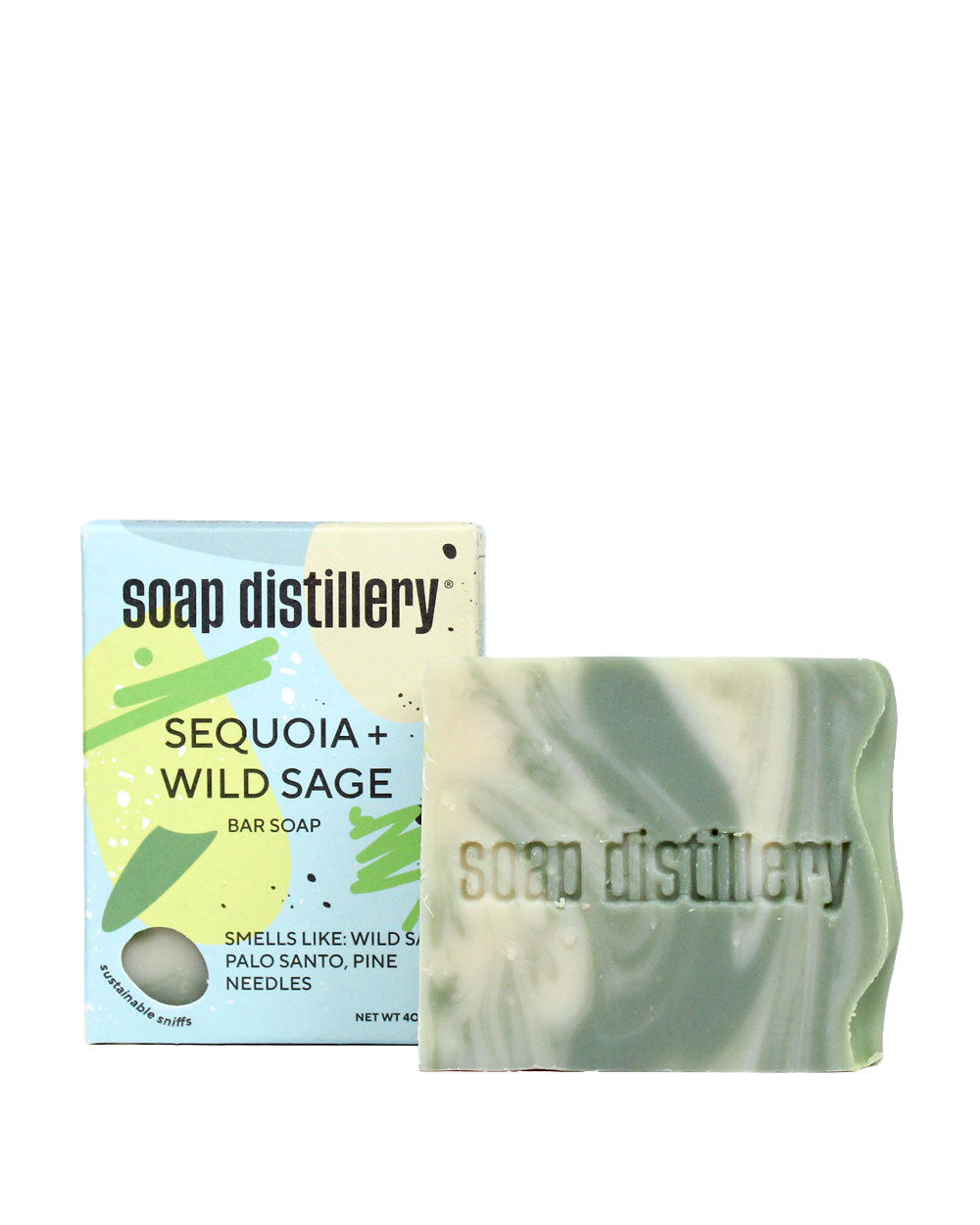Bar soap with green marbled swirl beside soap distillery carton box
