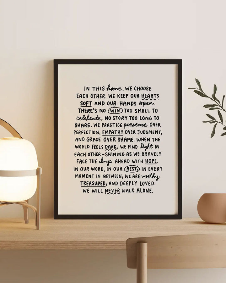 Framed manifesto art print with black border and white background, inspirational text.