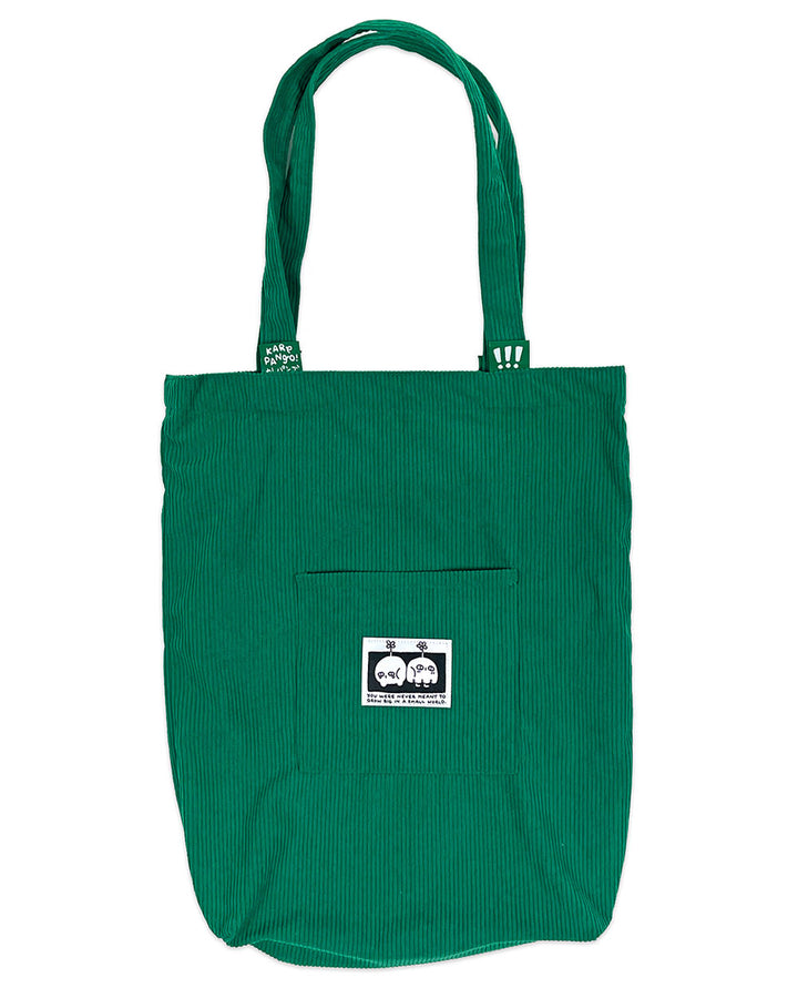 Green corduroy tote bag front with small center label and stitched pocket