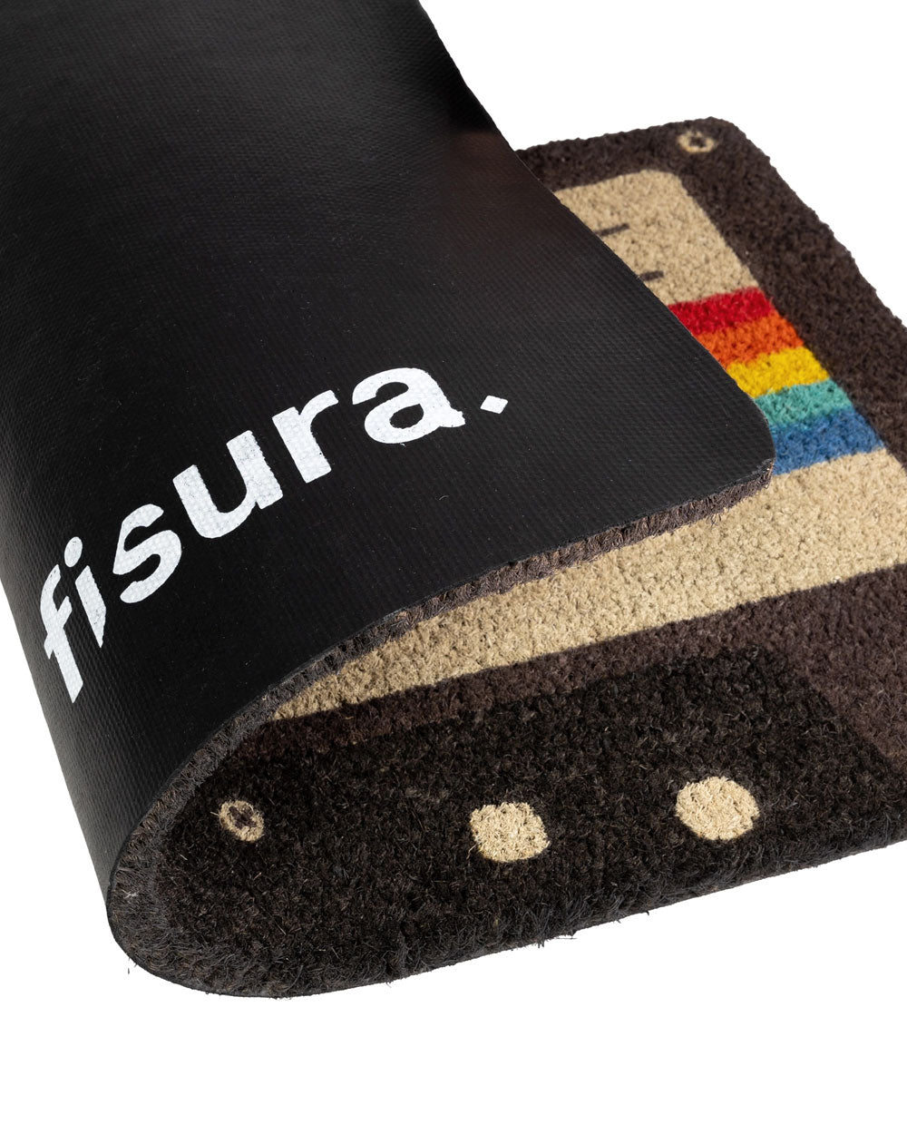 Cassette doormat corner with white "f1sura-" text on black fabric and tufted edge