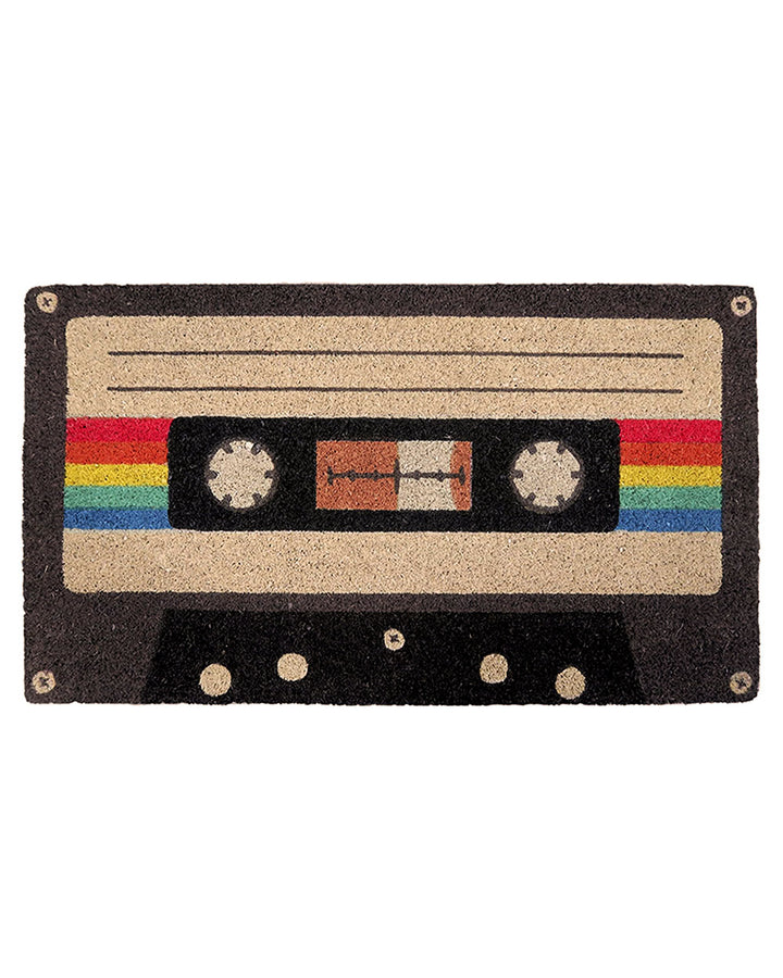 Cassette tape doormat featuring beige cassette label, rainbow stripes, and black background