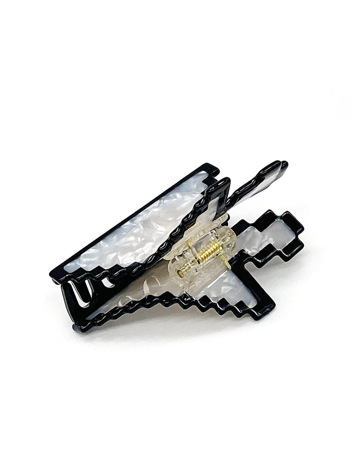 Cursor arrow claw hair clip with iridescent white top, black teeth, and gold hinge detail