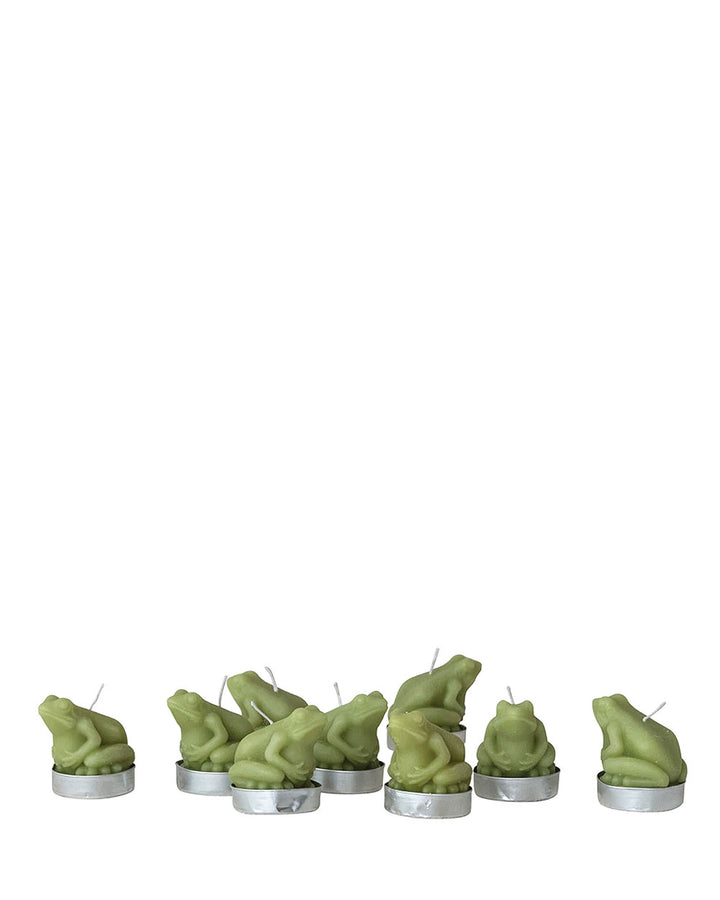 Row of green frog-shaped tea lights in silver metal cups