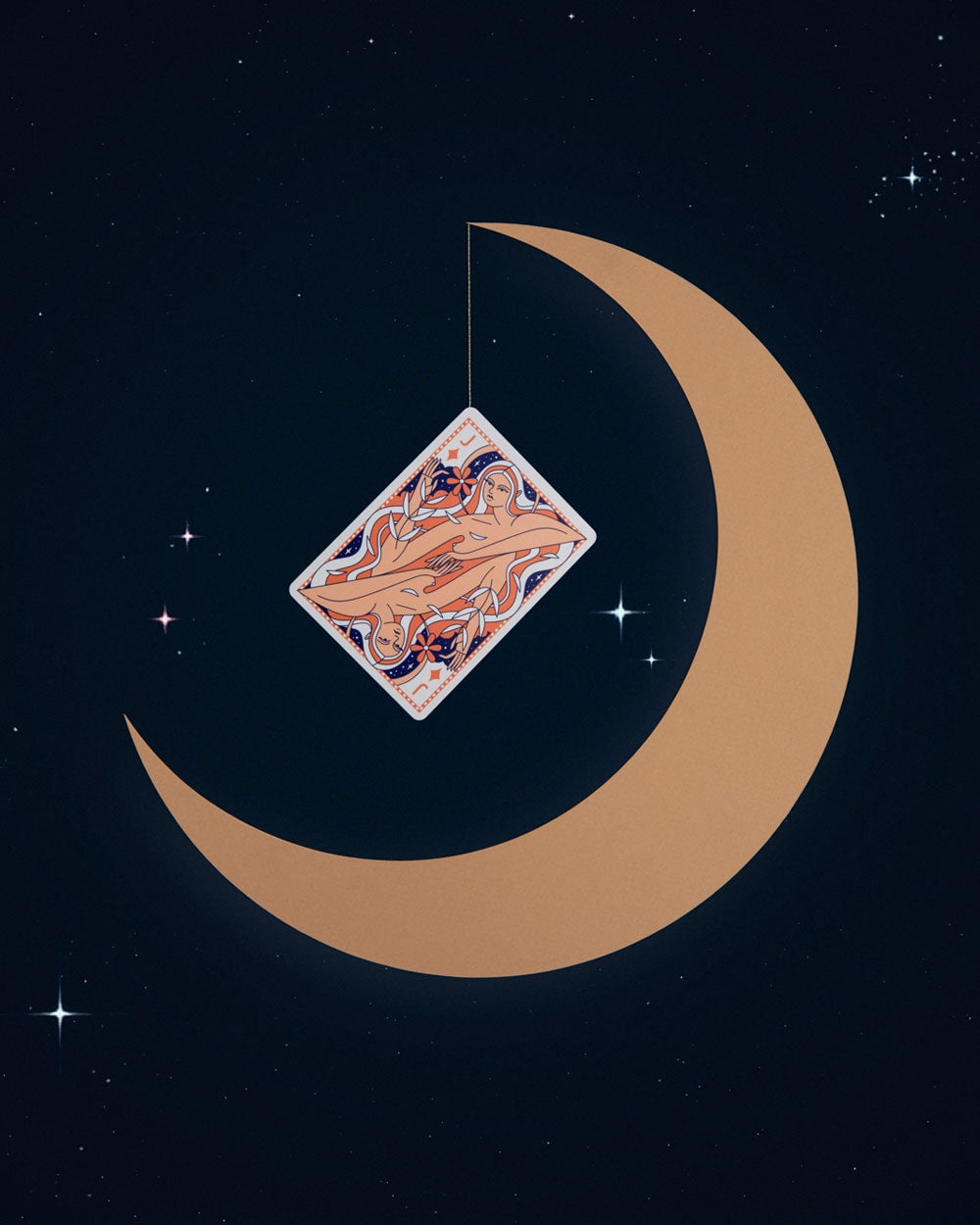 Ornate playing card with Lady Moon artwork centered by tan crescent
