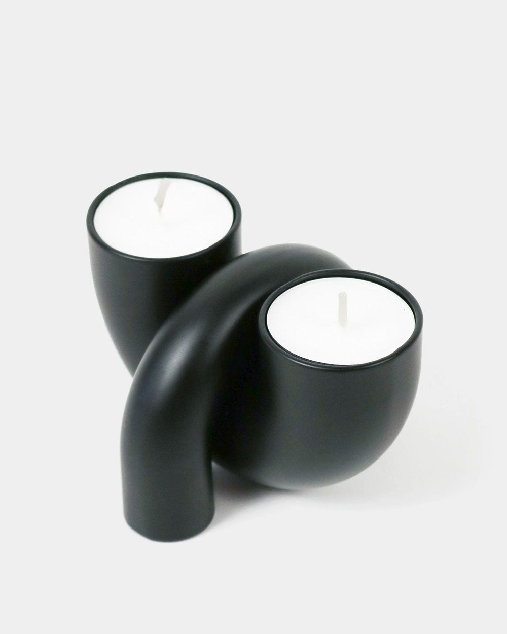 Black Macaroni 2-in-1 candle holder with curved cups for a tealight and taper
