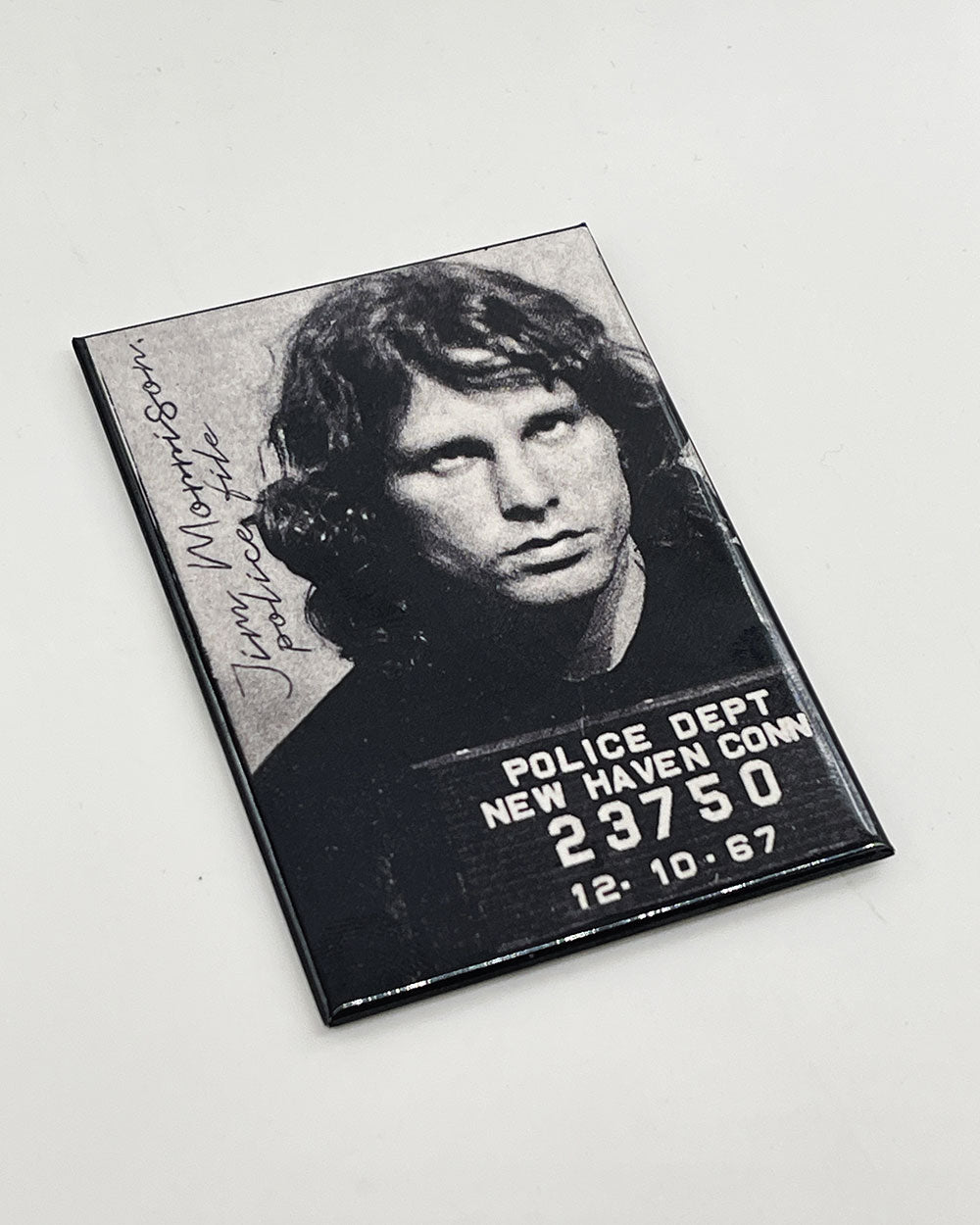 Square mugshot magnet with black-and-white portrait and police department text