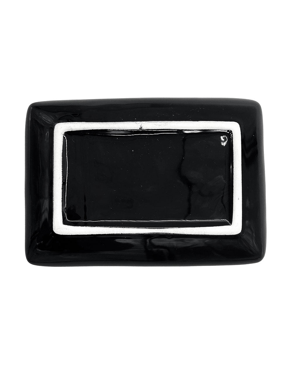 Underside of the black rectangular tray with a white outlined base