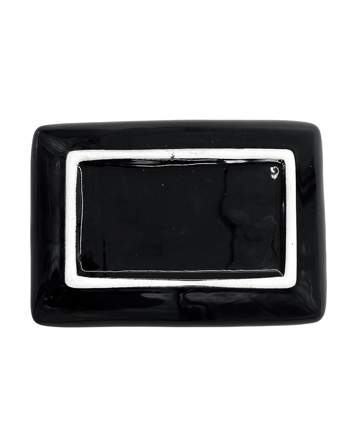 Underside of the black rectangular tray with a white outlined base