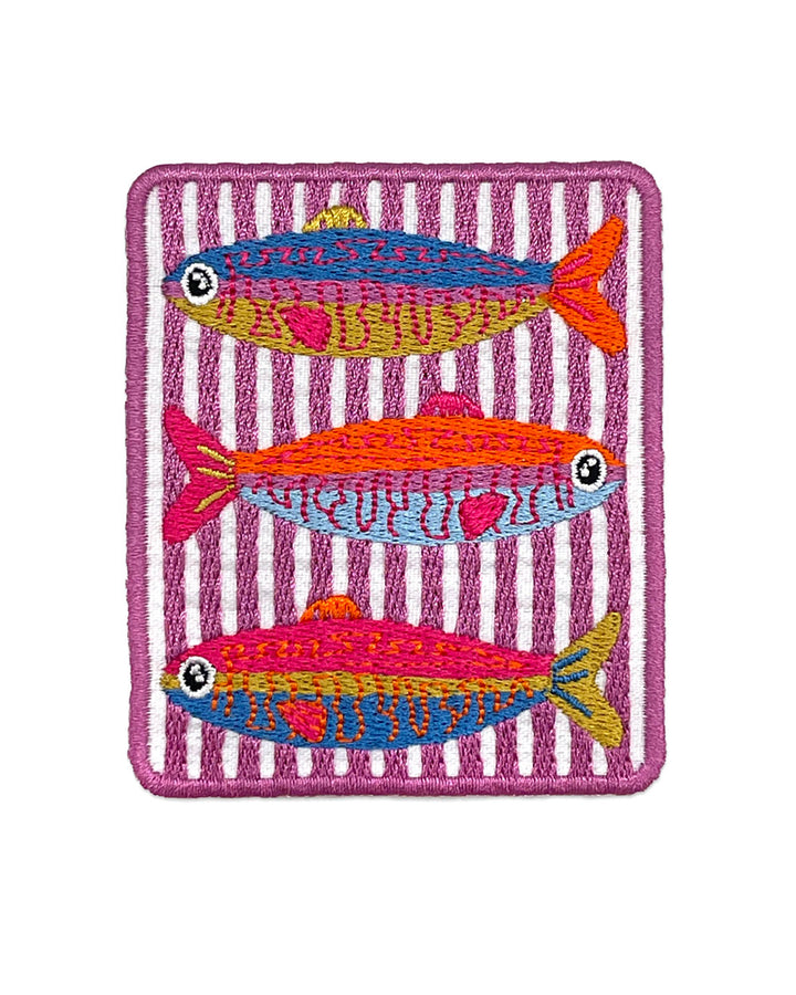 Square embroidered fish patch with three sardines on purple striped fabric backing