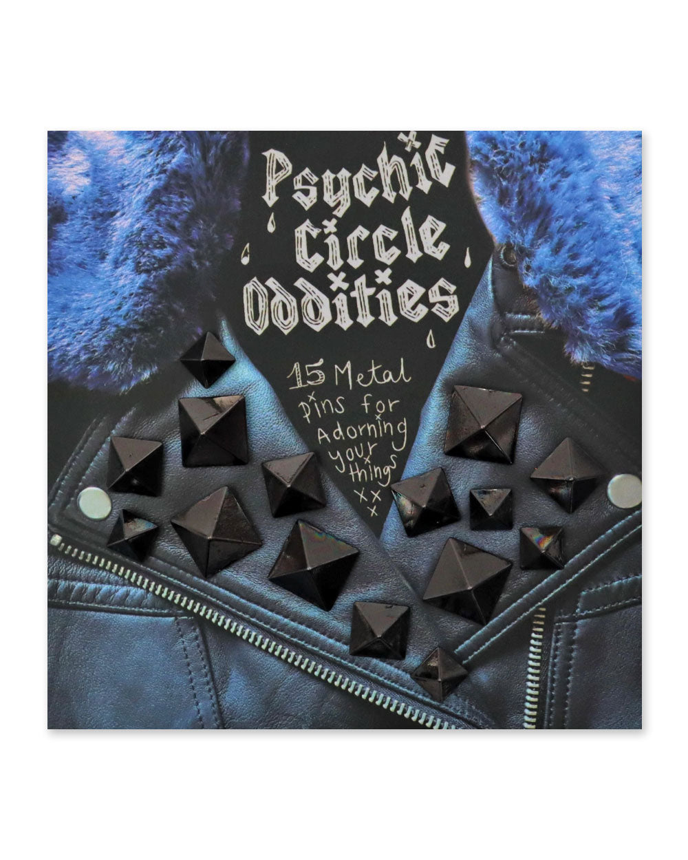 Black pyramid studs on dark denim jacket, scattered around zipper and pockets