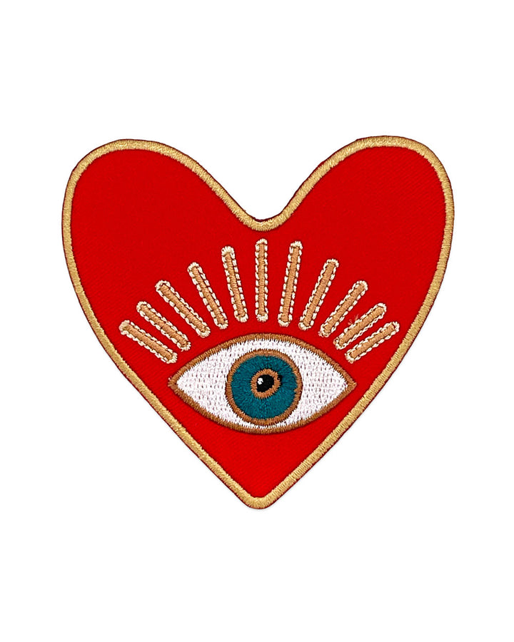 Heart-shaped red embroidered protection patch with gold border and stitched eye detail