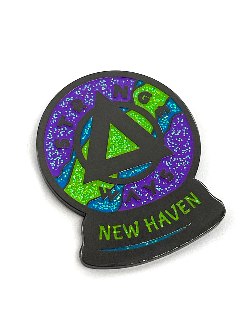 Colorful New Haven crystal ball enamel pin with black outline and green accents