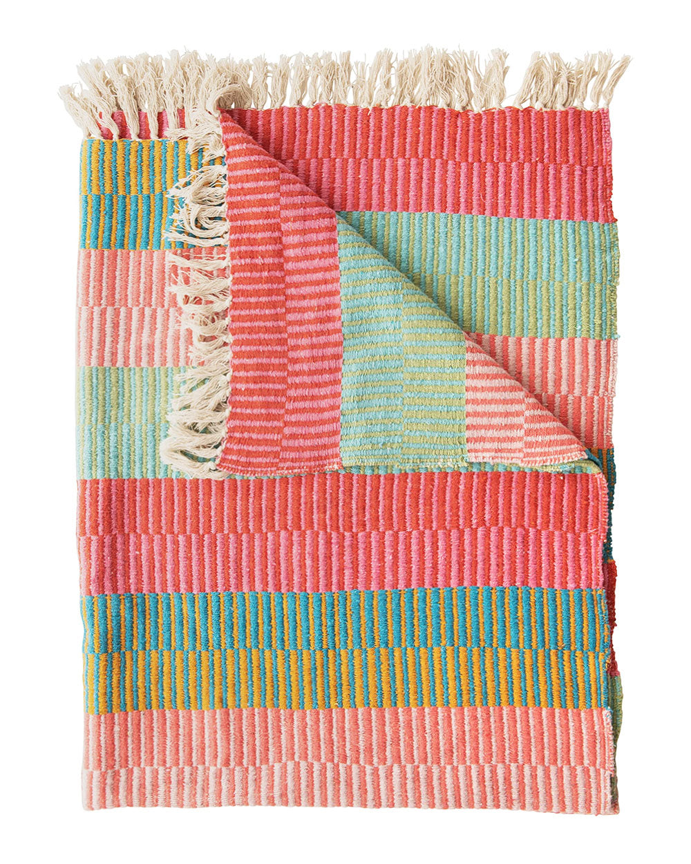 Folded striped throw blanket with fringed trim in coral, teal, red, and cream