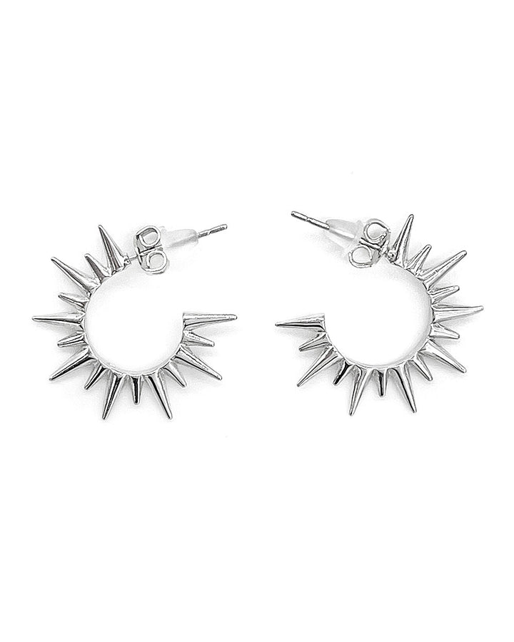 Silver hoop earrings with spiked sunburst design and hinged post backs