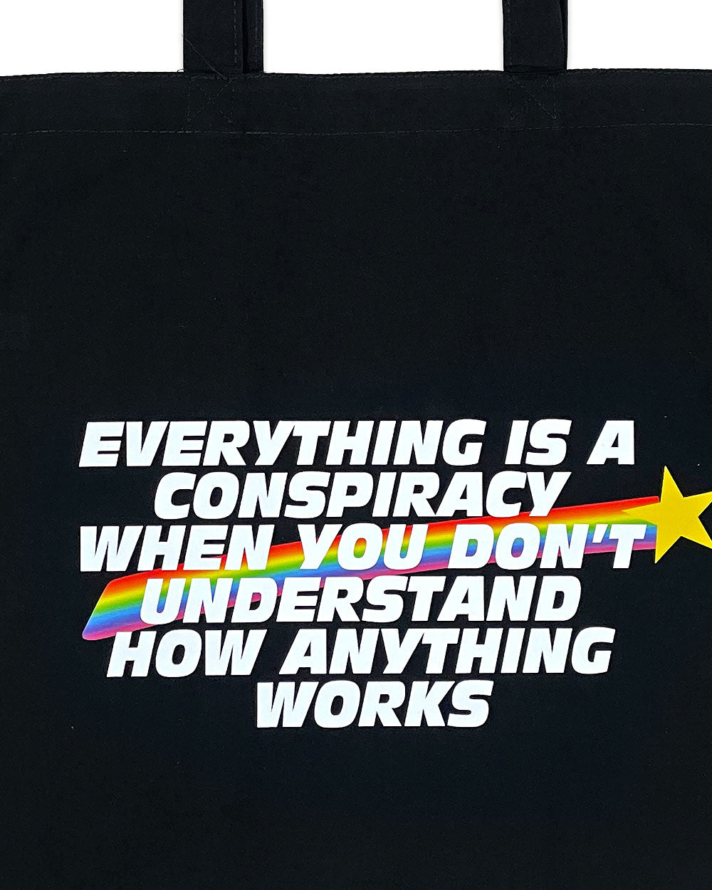 Black tote bag with colorful conspiracy text graphic and star.
