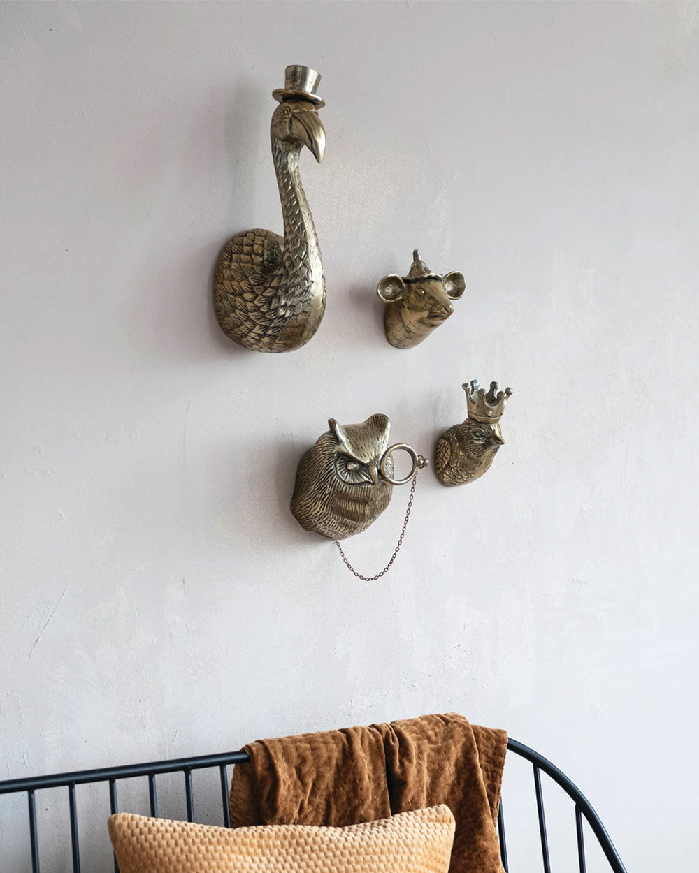 Bronze-tone bird wall sculpture with crown, small birds and hanging chain