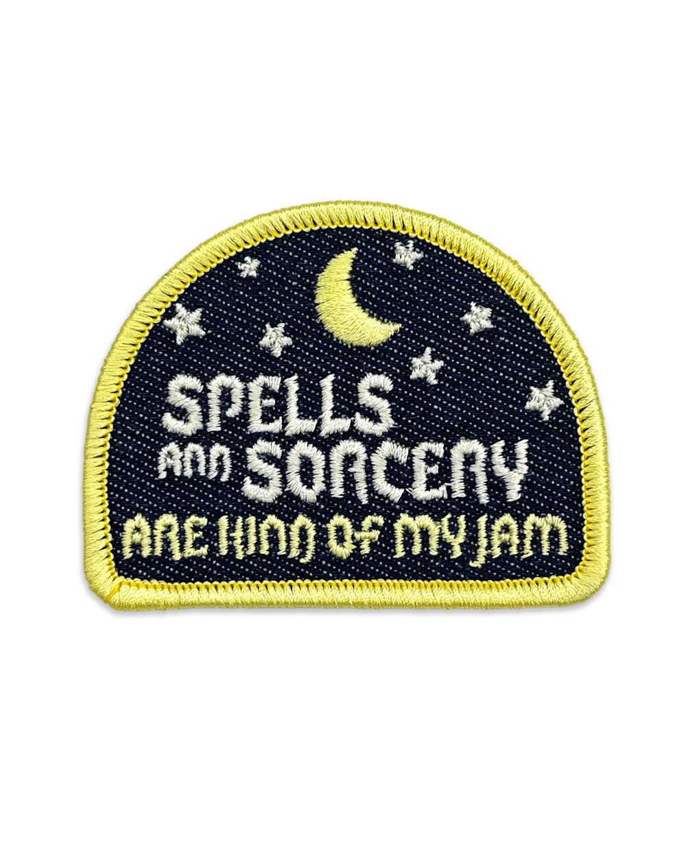 Embroidered navy patch with yellow border, crescent moon, stars, and SPELLS & SORCERY