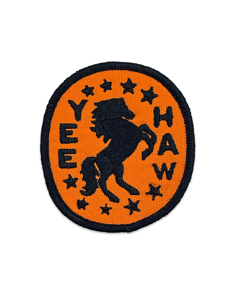 Round orange horse patch with black silhouette, YEE HAW lettering, and star accents
